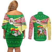 Ethiopia Christmas Couples Matching Off Shoulder Short Dress and Long Sleeve Button Shirt with Santa Riding Lion Ethiopian Flag Colors and Tribal Pattern Design - Shopicos
